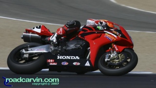 2007 Corona AMA Superbike Championship - Jake Zemke Turn 2: Jake Zemke hanging off his Honda in turn 2.